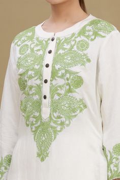 White kurta with pistachio green thread embroidery at the placket and sleeves. Comes with straight fit pant.
Component: 2
Embroidered
Neckline: Mandarin Collar
Sleeve Length: Full
Fabric: Linen Satin Blend
Color: White
Front button placket
Pom-pom detailing at the side seams
Embroidered straight fit pant - Aza Fashions Green Cotton Kurta With Embroidered Border, Green Long Sleeve Top With Intricate Embroidery, Green Straight Kurta With Embroidered Border, Green Embroidered Straight Kurta, Green Mulmul Kurta With Embroidered Border, Green Chikankari Embroidery Top For Wedding, Green Chikankari Embroidered Top For Wedding, Green Long Sleeve Traditional Wear With Embroidered Border, Long Sleeve Mulmul Kurta With Intricate Embroidery