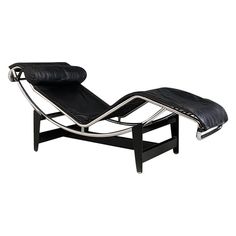 a black leather chaise lounge chair on white background