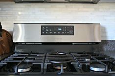 a stainless steel stove top oven in a kitchen