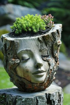 a tree stump with a planter in the shape of a woman's face