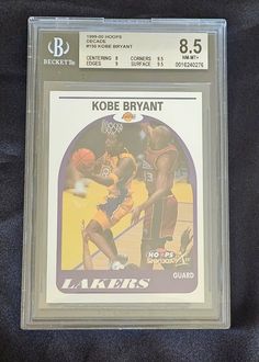 a basketball card with an image of the lakers's kobe bryant on it, in front of a black background