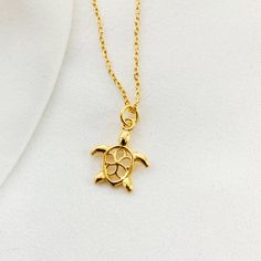 "GOLD TINY TURTLE necklace | Silver 925 Turtle charm | tortoise Animal jewelry | Turtle Lover gift | sea turtle jewelry | swimming turtle ♡ DESCRIPTION A delicate tiny necklace with beautiful filigree charm. ♡ DETAILS turtle high: 0.94\"- (2.4 cm) Total chain length : 16.5\"(42 cm) Material: gold plated 24 k over sterling silver 925 extender chain you can find here: https://www.etsy.com/listing/723669241/add-an-extender-chain-with-tiny-heart?ref=shop_home_active_2 The jewelry is made entirely of Turtle Shaped Sterling Silver Jewelry Gift, Sterling Silver Turtle Necklace For Gifts, Sterling Silver Turtle Jewelry Gift, Sterling Silver Turtle Necklace For Gift, Elegant Yellow Gold Turtle Jewelry, Swimming Turtle, Book Basket, Seahorse Jewelry, Sea Turtle Jewelry