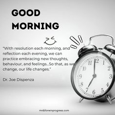 an alarm clock sitting in front of a white background with the words good morning on it