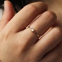 A simple 14k gold-filled signet band with Rainbow Moonstone gemstone set in the center.  ∙ Gift Ready in a jewelry box! ∙ Handmade in Vancouver, Canada.  ∙ 100% 14k Gold Fill or Sterling Silver ∙ Ring Sold Individually --------------------------------- M E A S U R E M E N T :  Width: 1.25mm  Gemstone: 4mm Moonstone Size: Optional (US measurement) If your ring size is not specified as an option, please message me directly so we can create a custom ring together!  Please note that the blue flash w Minimalist Yellow Gold Moonstone Ring For Everyday, Gold Minimalist Moonstone Ring As Gift, Minimalist Handmade Gold Moonstone Ring, Minimalist Gold Open Moonstone Ring, Adjustable Minimalist 14k Gold Moonstone Ring, Gold Moonstone Ring, Moonstone Engagement Ring, Rainbow Moonstone Ring, Ringe Gold