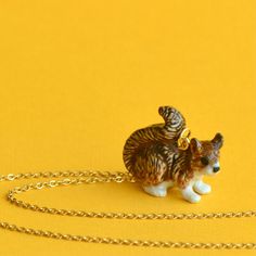 "You'll look bright-eyed and bushy-tailed every time you wear this little squirrel necklace! 🥇 crafted from fine porcelain meticulously hand painted in detail 🌳 heirloom quality ✔️ highly collectible 🔗 24\" 24k gold steel chain 💝 individually gift boxed ✈️ free domestic shipping 📿Adorably stylish and completely unique, Camp Hollow's line of whimsical wearables are made of high quality porcelain and painted in intricate detail to depict some of nature's most beautiful creations! ⛺️CampHollow Squirrel Necklace, Hand Painted Pendant, Porcelain Animal, Porcelain Jewelry, Necklace Craft, Have Metal, Ceramic Pendant, Beautiful Stories, Hand Painted Porcelain