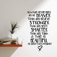 there is a wall sticker that says, always remember you are braver than you believe