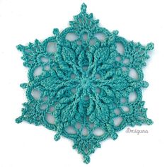 a crocheted snowflake is shown on a white background