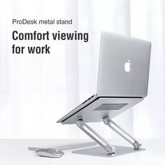 an apple computer sitting on top of a desk with the words, prodesk metal stand comfort viewing for work