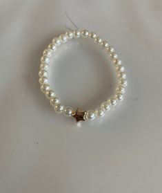 LIMITED TIME ONLY!! Pearl beaded bracelet with gold star (not real gold!) Bracelet With Stars, Gold Bead Bracelet Ideas, Pearl Beads Bracelet Ideas, White Pearl Bracelet Diy, Pearl Bead Jewelry, Star Bracelet Bead, Beaded Bracelets Pearl, Diy Pearl Bracelet Ideas, Star Beads Bracelet