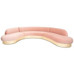 the curved couch is pink and gold