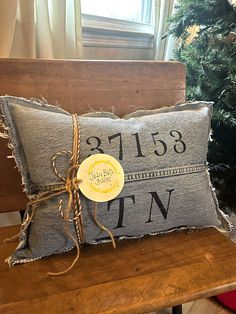 "Our  18.5\"L  X 12.5\" H lumbar \"Zip Code/State\" pillow is a special way to personalize a gift that everyone loves in their home. This pillow will be customized with the Zip Code/State initials that you specify. It is thickly stuffed with premium polyester poly fill and will be immediately ready to love! The fabric for this pillow is up-cycled denim and perfectly frayed for that rustic, down home feel that compliments any decor.  You may specify what color denim you prefer-light wash, medium Zip Code Decor, Denim Pillows, Scatter Pillows, Customized Pillow, Diy Throw Pillows, Denim Pillow, State Pillow, New Home Owner, Denim Crafts Diy