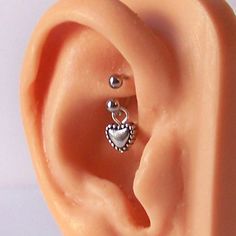 an ear with two hearts attached to it