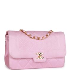 This Vintage Small Flap bag is in Pink satin fabric with gold tone hardware and features a front flap with signature CC turnlock closure, and an interwoven gold tone chain link and pink leather shoulder strap. The interior is lined in Pink satin featuring a zip pocket with a classic CC logo pull and a slip pocket underneath. Collection: 1-series (1989-1991) Origin: France Condition: Vintage; Mint - This bag retains its structure. The exterior shows minor discoloration at the edges and creasing. There is no plastic on the hardware which shows faint brushing. The interior shows minor signs of wear including some markings. Accompanied by: Chanel dustbag and COA card Measurements: 9" width x 5.5" height x 2" depth; 16.5" strap drop (9.5" doubled) Pink Satin Fabric, Handbag Wallet, Wallet Accessories, Cc Logo, Vintage Chanel, Pink Satin, Fendi Bags, Flap Bag, Pink Leather