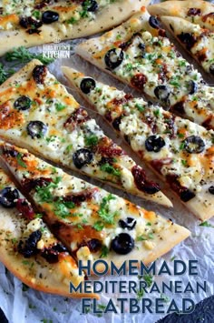 homemade mediterranean flatbread pizza with olives and parmesan cheese