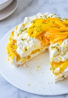 a white plate topped with a cake covered in cheese