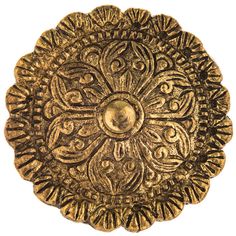 an antique brass plate with ornate designs