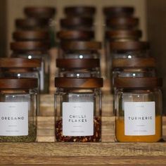 several jars filled with different types of spices