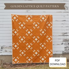 the golden lattice quilt pattern is on display in front of a white building with an orange background