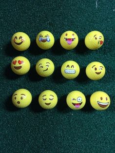 nine yellow balls with different emoticive faces on them, all lined up in a row