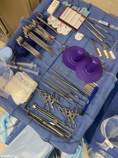 the table is covered with surgical equipment and medical supplies