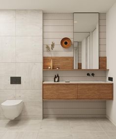 a bathroom with a toilet, sink and mirror on the wall next to each other