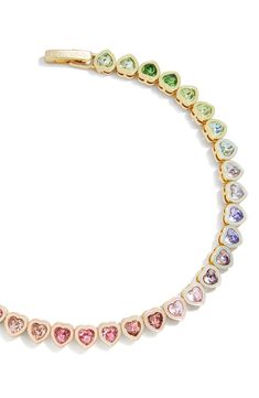 Add a dash of romance to your wrist with this whimsical tennis bracelet hosting a rainbow gradient of crystals in dainty heart settings. 7" length; 1/8" width Goldtone plate/glass Imported Playful Multicolor Heart Bracelet, Multicolor Heart-shaped Bracelet, Trendy Rainbow Heart-shaped Jewelry, Sweet Multicolor Heart-shaped Jewelry, Playful Multicolor Heart-shaped Bracelets, Heart Tennis Bracelet, Dope Jewelry Accessories, Rainbow Gradient, Makeup Bronzer