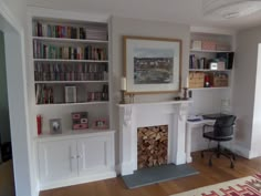 a living room filled with furniture and a fire place in front of a book shelf