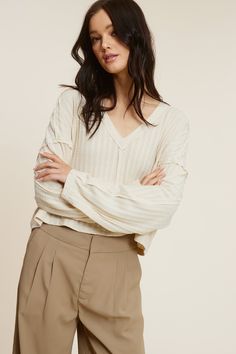 The All The Way Beige Long Sleeve Crop Top delivers both style and comfort! Its beige Pointelle-effect solid-knit fabric shapes a V-neckline top that features an oversized cropped bodice, exposed seams, drop shoulders, and long sleeves. The relaxed silhouette pairs perfectly with jeans and trousers! DETAILS & FIT Oversized Fit. 97% Polyester, 3% Spandex. Model is 5'8" 33-24-35 wearing a size Small. Machine wash cold. Imported. Oversized Crop Top, Beige Long Sleeve, Trousers Details, Boho Pink, Exposed Seams, Beige Top, Pink Boho, Long Sleeve Crop, All The Way