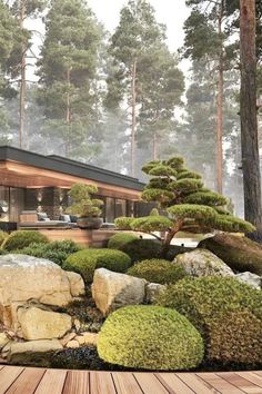 a house surrounded by trees and rocks