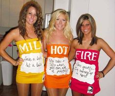 three women dressed in funny costumes posing for the camera