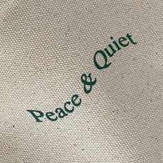 the words peace and quiet are written in green ink