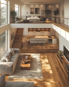 a living room filled with lots of furniture next to a large open floor plan on top of a hard wood floor