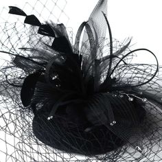 Black Hat with Birdcage Veil Add vintage charm to your wedding or special occasion with this elegant birdcage face veil bridal hat. This wedding headpiece has a gorgeous black flower decorating the top of the hat, with accents of sparkling crystals and sprays of feathers. Size: Flower Feather Accent on Hat Measures 4-1/2" x 7" Wide - Veiling extending off the hat measures 7-1/2" Long - Round Hat Measures 3-3/4." Color: Black. Style: hp8366b. Alligator Clip underneath hat for placement. Perfect f Goth Wedding Theme, Black Birdcage Veils, Gothic Party, Veil Headpiece, Hair Comb Clips, Indian Wedding Cards, Feather Fascinator, Bridal Hat, Goth Wedding