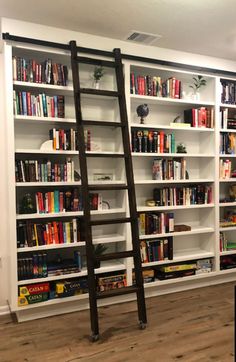 a ladder leaning up against a bookshelf filled with books