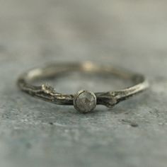 Diamond Twig Bridal Set Unique Engagement Ring Woodland Wedding Set Twig Ring Wedding Band Rose Cut Grey Diamond Rustic Engagement Set Materials: .925 Sterling Silver; 3mm Rose Cut Diamond I am in love with this ring! Wear it alone or stack it with one of our hammered bands. Handmade from a real cast twig, your ring will be made to size just for you. We then expertly solder a silver bezel setting securely onto the twig band and set the genuine 3mm rose cut gray diamond. It is paired with a match Sterling Silver Wedding Diamond Ring, Dainty Silver Crystal Wedding Ring, Adjustable Sterling Silver Diamond Ring For Wedding, Dainty Silver Crystal Ring For Wedding, Stackable Rose Cut Diamond Wedding Rings, Delicate Silver Stackable Rings With Rose Cut Diamonds, Delicate Adjustable Diamond Wedding Ring, Adjustable Diamond White Crystal Wedding Ring, Delicate Adjustable Wedding Diamond Ring