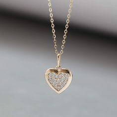 "14K Solid Gold Necklace Heart Pendant Necklace Diamond Necklace Minimalist Jewellery Dainty Necklace for Women Necklace for Girls Embrace the symbol of love and elegance with our 14K Solid Gold Heart Pendant Necklace. This dainty and minimalist jewelry piece showcases a stunning design of a heart pendant, with diamonds of Cubic Zirconia, adding a touch of sparkle to any outfit. Perfect for women and girls, it's a timeless and cherished accessory that effortlessly enhances your beauty. * Materials: 14K Solid Gold (AU585), Cubic Zirconia  * Dimensions: Length of the pendant 15mm, Heart: 10.3*9.3mm, Chain 45cm * Care: \"I am a dainty 14K solid gold necklace. Please be gentle and handle with extra care. ♡\" ♡ The item is a perfect gift for different occasions and purposes, such as a Birthday 14k Gold Necklace For Valentine's Day, 14k Gold Heart Pendant Necklace With Adjustable Chain, 14k Gold Pendant Charm Necklace For Valentine's Day, Minimalist Heart Charm Jewelry For Anniversary, Dainty 14k Gold Heart Pendant Necklace, Minimalist Heart Charm Jewelry For Anniversary Gift, Delicate Rose Gold Heart Pendant Necklace, 14k Gold Clavicle Chain Necklace For Valentine's Day, Heart Necklace With Delicate Chain For Anniversary