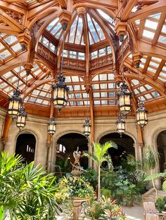 the inside of a large building with lots of plants