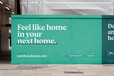 a large sign on the side of a building that says, feel like home in your next home