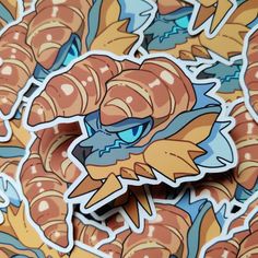 a sticker with an image of a dragon surrounded by many smaller ones in orange and blue colors