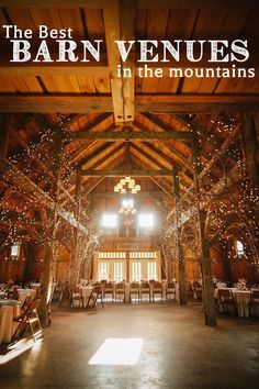 the inside of a barn with tables and chairs