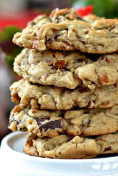 a stack of cookies sitting on top of a white plate