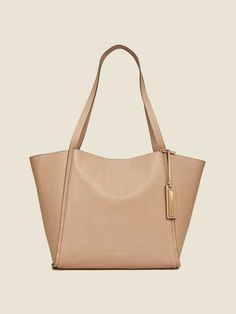 Brand: DONNA KARAN New York Main color: buff Details: Donna Karan pebbled leather tote bag. In-line shoulder straps, 12" drop. Detachable logo tag. Open top with snap closure. Inner slip pocket. 11"H x 12"W x 6.5"D. Imported. Retail price $398 Comes with dust bag Material: 100% cow leather. Condition: new with tags. 100% authentic. USA: - USPS Standard Mail - FREE SHIPPING INTERNATIONAL SHIPPING - varies by buyer's location * Shipping is worldwide. * We ship via United States Postal Service * We Beige Pebbled Leather Bag With Gold-tone Hardware, Gold Double Handle Work Bags, Beige Pebbled Leather Shoulder Bag With Double Handle, Beige Pebbled Leather Shoulder Bag With Gold-tone Hardware, Beige Pebbled Leather Satchel With Double Handle, Beige Pebbled Leather Bag With Double Handle, Pebbled Leather Double Handle Shopping Bags, Classic Pebbled Leather Shoulder Bag With Handle Drop, Shopping Pebbled Leather Satchel With Leather Handles