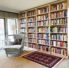 a living room filled with lots of books