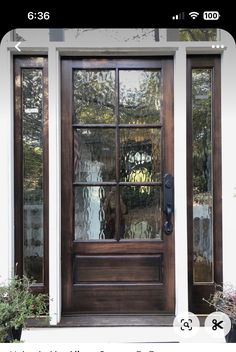 an image of a front door with glass on the outside and side windows in the inside