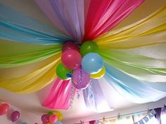 the ceiling is decorated with balloons and streamers