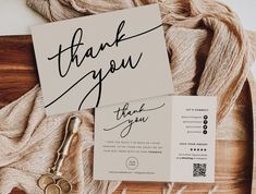 a thank card with the words thank you on it next to a pair of scissors