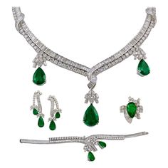 A regal suite comprising a necklace, bracelet, earrings and matching ring, all of similar design, each crafted in 18k white gold set with brilliant diamonds and pear shape emeralds. The suite is comprised with approximately 25 carats of diamonds and 40 carats of emeralds. Condition: Good - Previously owned and gently worn, with little signs of use. May show light scratches but has no structural issues. Ruby And Diamond Necklace, Pear Shaped Diamond Ring, Emerald Diamond Earrings, Marquise Shape Diamond, White Gold Set, Matching Ring, Colombian Emeralds, Emerald Necklace, Expensive Jewelry