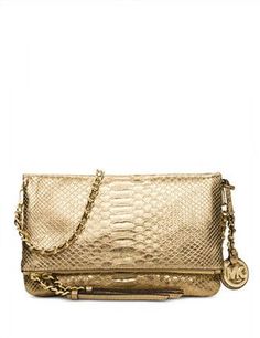 This must have medium messenger bag is perfect for day or night. designed in rich python embossed leather with a slinky chain-link strap. Adjustable strap with 21-3/4" dropFold-over flap with zipper closureExterior features gold-tone hardwareInterior features 1 slip pocketSize: 10-1/2" W x 6-3/4" H x 1" DColor: Gold Embossed Bag, Michael Kors Outlet, Belt Purse, Travel Wardrobe, Pale Gold, Leather Messenger Bag, Leather Messenger, Womens Crossbody Bag, Handbags Michael Kors