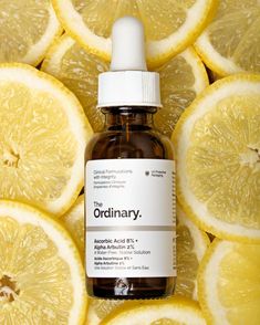 an ordinary bottle of vitamin oil surrounded by sliced lemons with the word ordinary on it