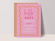 a pink and orange hello baby card with scalloped edges